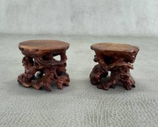 A pair of hand-carved, tree root-style wooden display stands, each 2"W x 1-3/4" tall, typically used for bonsai trees, small pottery, or figurines.