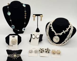 Beautiful jewelry including a 1940s vintage Mazer Starburst bracelet, a mid-century vintage Jomaz flower brooch featuring a cluster-head of white faux pearls and clear rhinestones set in a silver-tone metal stem and leaf design, a multi-strand white freshwater rice- or baroque-pearl necklace, a statement necklace featuring large, iridescent aurora borealis faceted crystal/glass oval beads interspersed along a link chain; vintage cluster clip-on earrings, including aurora borealis (AB) crystal styles, black-and-white art glass/beaded clusters, and faux pearl-and-crystal domed clusters