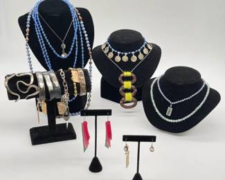Leather strap bracelets with silver metal word plates; beaded and pendant necklaces; earrings