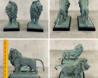 A pair of Art Institute of Chicago Lion Bookends - miniature replicas of the iconic bronze lion statues by American sculptor Edward Kemeys, which have guarded the entrance of the Art Institute of Chicago since 1893. Poly stone on wooden base, 9.75 x 11 x 5.75 in.