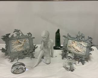 Pair of antique Volkstedt Jasperware-style high relief porcelain plaques from Germany, featuring classical draped female figure with flying putti and elaborate Rococo/Baroque scrollwork frames; a Kaiser Porcelain bisque figurine "Meditation" #489, nude woman sculpted by artist Wolfgang Gawantka for AK Kaiser of West Germany; a green glazed ceramic model replica of the Ruskin Monument located at Friar's Crag on Derwentwater in Keswick, Lake District, England