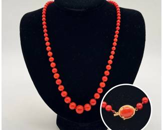 A vivid red round natural stone graduated bead necklace with 14K gold clasp