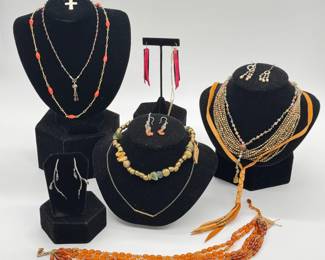 A variety of necklaces, chain link, chunky, delicate; earrings and pendants