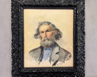 Antique 1895 watercolor portrait of a bearded man wearing a blue shirt and grey jacket, set within an ornate dark carved wooden frame, artists' initials signed lower right with '95 date. Overall measurement 15-3/8"W x 17"H.