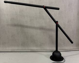 A table lamp in the style of Mario Arnaboldi's "Mira" lamp