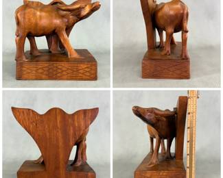 A vintage mid-century hand-carved wooden water buffalo bookend made from solid hardwood, 7 inches tall