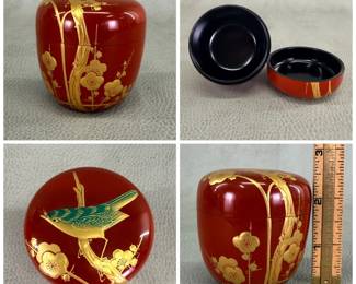 A traditional handcrafted Japanese Natsume lacquerware tea caddy featuring a vermilion (red) and black lacquer finish with gold leaf or maki-e floral and decorative accents; 2-1/2" tall.