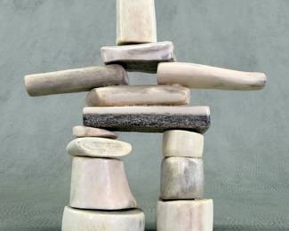 A carved antler handcrafted Inukshuk figure, 5"W x 5.25"H x 1-3/8"D