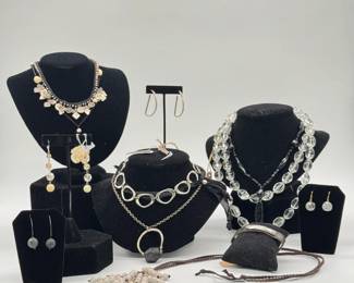 A selection of costume jewelry including necklaces, earrings, brooches, bracelets
