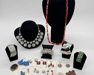 Vintage jewelry including a silver-tone cluster and bubble-style statement necklace encrusted with clear rhinestones, AB crystal cluster bracelet, a variety of costume jewelry earrings and brooches, modernist cuff bracelets, and enamel-on-copper earrings by by Audrey and Robert Engstrom
