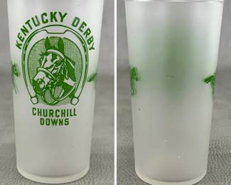 1948 Kentucky Derby glass for mint juleps; frosted glass with a green horseshoe enclosing a horse head with the text “Kentucky Derby Churchill Downs,” flanked by small graphics of running horses.
