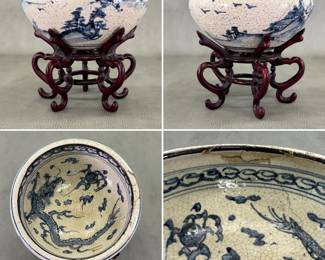 Second one of a pair of Chinese porcelain bowls, with underglaze blue hand-painted landscape scenes to the exterior and a dragon chasing flaming pearl of wisdom on the interior, beneath a band of clouds. Heavy crackled Ge ware style glaze, unglazed footrims.  Each bowl comes with dark-stained, hand-carved hardwood or rosewood pedestal stand featuring five curved legs. Bowl 7"W x 3-1/26"H, total height with stands 6-1/4".