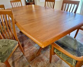 Nordic Furniture located in Markdale, Ontario, Canada.  Teak dining set with built in leaf storage