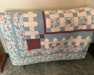 Large patchwork quilt w white picket fence