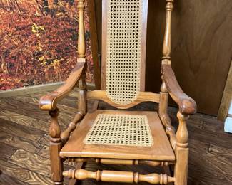 Antique rocker with cane seat and back
