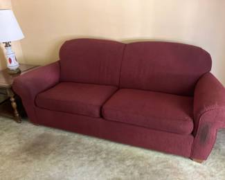 Sofa w burgundy upholstery