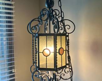Ornamental iron swag lamp with stained glass
