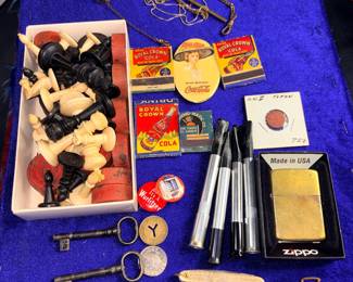 Collection of items, including antique matchbooks, zippo, pocket knives, smoking accessories, and more