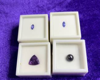 Collection of gemstones, including Tanzanite , amethyst, Tahitian,pearl