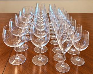 Large collection of Riedel crystal wine glasses featuring an assortment of stemware in multiple bowl shapes and sizes suitable for red wine, white wine, sparkling wine and entertaining. The collection includes generously proportioned rounded wine glasses, traditional elongated wine glasses and tall champagne flutes, all displaying Riedel’s clean, elegant styling. Glasses are marked Riedel at the foot. An excellent opportunity to acquire a substantial coordinating collection from one of the best-known names in wine glassware. Pre-owned condition with light wear consistent with normal use and storage. Please review photographs for exact quantities, individual styles and condition.