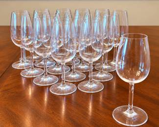 Set of sixteen Schott Zwiesel Porto crystal stemmed glasses featuring an elegant clear bowl, distinctive square-form stem with sculptural twist detail, and circular foot. This specialized Porto/port wine form was designed for serving and tasting fortified wines, with a proportioned bowl intended to concentrate aromatics. Schott Zwiesel is a respected German glassmaker known for high-quality crystal stemware. The unusual square-stem Porto design gives this set a particularly refined presentation and makes the complete group of sixteen desirable for entertaining, wine tasting, or a dedicated port service. Examples of Schott Zwiesel's Porto tasting glass were produced for the Portuguese port-wine market, making this a more specialized form than the company's standard wine stemware. Includes sixteen glasses. Pre-owned condition; please review photographs for condition and completeness.