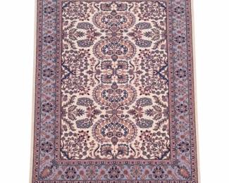 Elegant hand-knotted area rug featuring an intricate allover floral and foliate design in a soft, sophisticated palette of ivory, muted lavender and purple, dusty rose, blue-gray, navy, taupe, and subtle green. The symmetrical field is framed by multiple coordinating floral borders and finished with cream fringe at each end. The reverse reveals the woven construction and detailed continuation of the pattern. Measures approximately 78 inches long x 50 inches wide (6'6" x 4'2"). Pre-owned condition with age-appropriate wear and variation to the pile and fringe as shown. Exact age, fiber content, country of origin, and maker have not been independently identified. Please review photographs carefully for pattern, construction, color, and condition. Sold as photographed.