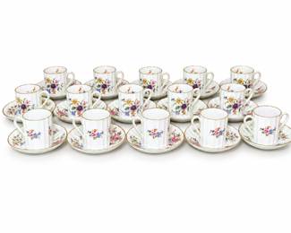 Beautiful collection of Royal Worcester “Roanoke” bone china, made in England, consisting of fifteen demitasse/espresso cups with fifteen matching saucers, for thirty pieces total. The Roanoke pattern features delicately fluted white bone china decorated with colorful English-style floral sprays in pink, purple, blue, yellow, orange and green, finished with fine gold trim. Cups feature graceful curved handles, while the matching scalloped saucers carry coordinating floral decoration. Pieces are backstamped “Royal Worcester Bone China – Made in England – Roanoke,” confirming the maker and pattern. An impressive fifteen-place Royal Worcester service well suited for espresso, after-dinner coffee, entertaining, display or addition to an English fine china collection. Vintage condition with age-appropriate wear, including possible minor wear to the gilt decoration and surface marks. Please review photographs closely for individual condition and details.