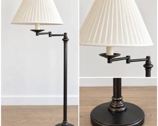 Classic traditional swing-arm floor lamp featuring a slender dark bronze-tone column with turned decorative accents and a substantial round stepped base. Adjustable articulated swing arm allows the light to be positioned for reading or task lighting. Topped with a large ivory/cream pleated fabric shade for a timeless, tailored appearance. An attractive accent lamp well suited for placement beside a reading chair, sofa, desk or bedside. Pre-owned condition with light surface wear consistent with normal use. Please review photographs for condition and details.