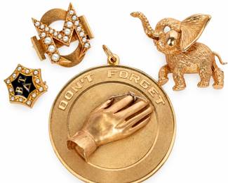 Vintage estate jewelry collection featuring four distinctive gold pieces, including a large round “DON’T FORGET” remembrance pendant with dimensional hand motif, a figural elephant brooch with raised trunk and textured detailing, a seed pearl-set monogram brooch, and a petite black enamel and seed pearl fraternity/sorority-style pin. Photographs show gold purity markings including 14K on the “Don’t Forget” piece and 10K on the petite enamel pin; additional maker and identifying marks are visible on the monogram piece. An appealing collection of antique and vintage sentimental, collegiate and figural jewelry with fine period detailing. Pieces show surface wear, scratches, patina and other signs of age and use. Please review all photographs, including hallmark and reverse views, as they are considered part of the description and are the best indication of identification, markings, condition and construction.