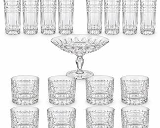 Elegant seventeen-piece clear crystal glassware collection featuring eight tall highball glasses, eight double old fashioned (DOF) tumblers and one coordinating pedestal compote bowl. The matching drinking glasses feature a distinctive repeating oval and faceted decorative band around the upper body with vertical detailing and substantial patterned bases. The coordinating pedestal bowl features a wide flared form with dimensional cut decoration and an elegant stemmed base. A handsome complete grouping ideal for cocktails, entertaining, barware display or a traditional home collection. Maker and pattern have not been confirmed. Pre-owned condition with expected signs of previous use; please review photographs carefully for condition, pattern details and all pieces included.