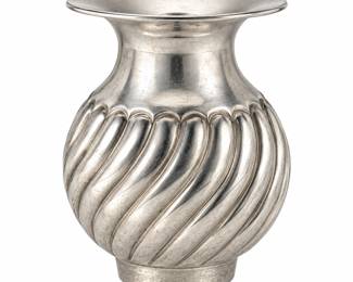 Vintage 900 coin silver vase featuring an elegant rounded form with deeply sculpted spiral fluting, a smooth upper neck, and broad flared rim. Crafted in .900 fine silver, the vase displays a striking swirling design that creates beautiful dimension throughout the body while retaining a classic and sophisticated profile. A handsome example of silver hollowware, ideal as a flower vase, decorative centerpiece, mantel accent, or addition to a collection of antique and vintage coin silver, Continental silver, and fine decorative arts. Marked 900 silver. Please review all photographs carefully for hallmarks, maker, measurements, surface wear, and condition, as photographs are considered part of the description. Dimensions 3 3/4" Tall