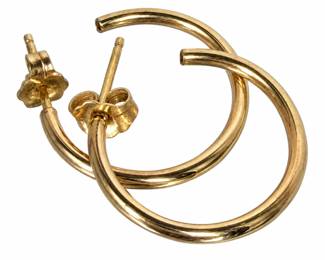 Two-pair collection of classic gold earrings featuring one pair of polished open hoop earrings and one pair of petite intertwined love knot stud earrings. Both pairs have post fittings with butterfly backs and offer timeless, versatile designs suitable for everyday wear or layering with other jewelry. The love knot studs are notably small and delicate in scale compared with the hoops. Metal content and maker are not confirmed unless otherwise noted or shown in photographs. Pre-owned condition with surface wear consistent with age and use. Please review all photographs carefully as they are considered part of the description and are the best indication of condition, design, and appearance.