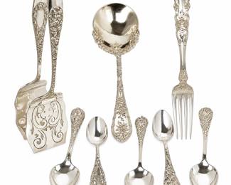 Beautiful collection of antique and vintage sterling silver serving and table utensils featuring an assortment of highly decorative floral, scroll, repoussé and pierced designs. Collection includes ornate sugar tongs, large serving ladle, four-tine serving fork and assorted spoons in several elaborate patterns. The richly detailed handles display roses, flowers, scrolling foliage and decorative cartouches characteristic of fine late nineteenth- and early twentieth-century silver flatware. An attractive assembled collection ideal for entertaining, table service, display or adding to an existing sterling silver flatware collection. Pieces show age-appropriate surface wear, light scratching and patina consistent with previous use. Patterns, makers and exact dates have not been confirmed; please refer to photographs and individual hallmarks, if present, for additional identification. Sold together as one collection.