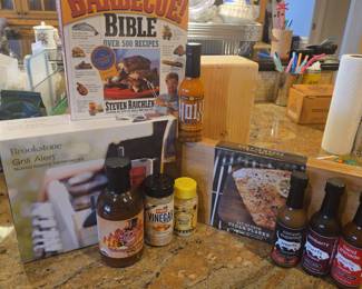 Title: BBQ & Grilling Collection – Barbecue Bible, Brookstone Grill Thermometer, Cedar Planks, Sauces & Seasonings Description: Fun grilling and barbecue collection featuring The Barbecue! Bible by Steven Raichlen, a Brookstone Grill Alert talking remote thermometer, Williams-Sonoma cedar grilling planks, assorted barbecue and hot sauces, seasonings, rubs, and grilling accessories. Great grouping for the backyard grill master, smoker enthusiast, summer entertaining, or outdoor kitchen. Includes a mix of packaged and previously owned items; please review photo for exact contents and condition.