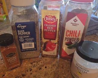 Title: Bulk Spice & Seasoning Collection – Black Pepper, Crushed Red Pepper, Chili Powder, Cayenne & Salt Description: Assorted pantry seasoning collection featuring large containers of Kroger ground black pepper, Tone’s crushed red pepper, Member’s Mark chili powder, cayenne pepper, and Diamond Crystal lemon salt. Great for cooking, grilling, barbecue, meal prep, or stocking a home kitchen. Containers are partially used; please review photo for exact contents, quantities, and condition.