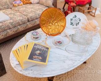 Vintage servingware, teacups, National Geographic magazines, Lyre Harp Coffee Table with marble top
