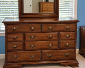 Traditional oak dresser with matching mirror. Part of complete matching bedroom set. Complete set $750.