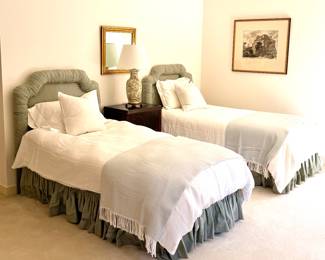 Linen duvets, Matouck throw blankets, custom headboar and matching bed skirt.
