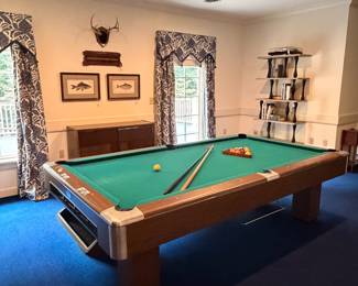 Please note: pool table conveys with the home. But it was hard to photograph this room without her in the shot!o
