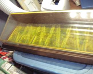 Antique scissor mercantile display back unlocks for access