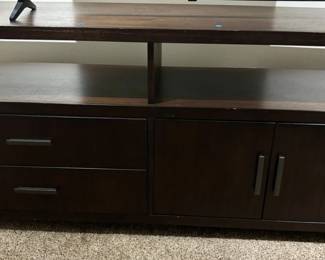 22 Dark wood TVentertainment console with drawers cabinets and shelving