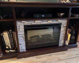 19 Dark wood electric fireplaceentertainment console with stonelook surr