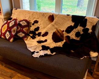 Cowhide rug and Futon with cover