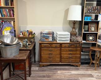 albums, cuckoo clocks, olympic pins, gift bags, dresser, tables