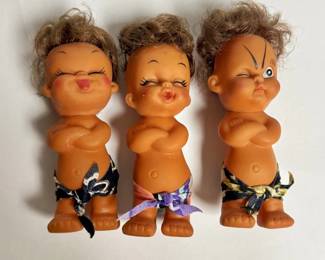 Vintage Moody Cutie rubber expression dolls from the 1960s or 1970s.
