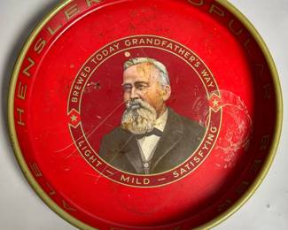 Vintage 13-inch metal advertising serving tray for Hensler's Popular Beer and Ale, produced by the Joseph Hensler Brewing Company of Newark, New Jersey around the 1940s to 1950s.