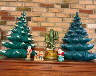 Large vintage green ceramic Christmas trees (sold as-is), and a vintage ceramic Christmas cactus.