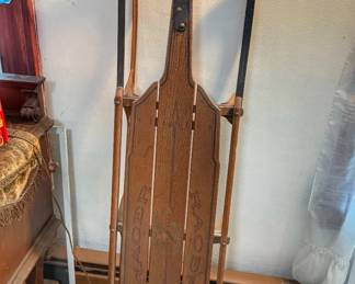 Vintage wooden snow sled from the early-to-mid 20th century.