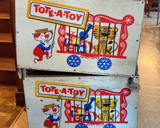 Vintage "Tote-A-Toy" circus-themed rolling toy boxes from the 1950s.