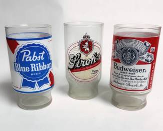 Vintage 1970s breweriana carnival beer glasses featuring iconic logos for Pabst Blue Ribbon, Stroh's, and Budweiser with frosted bases.